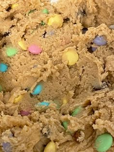 a cookie with easter eggs and chocolate chips on it's side is shown in close up