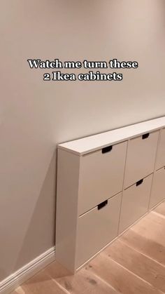 there is a white cabinet next to the wall with words on it that read watch me turn these 2 ikea cabinets