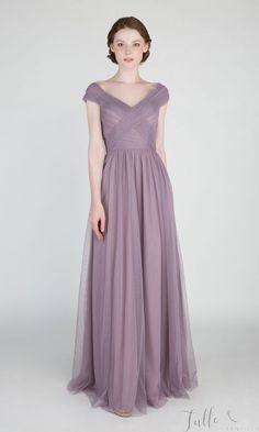 a woman in a long purple dress