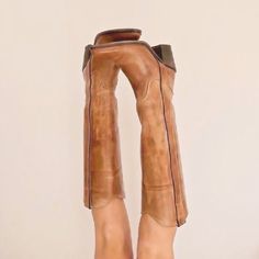 there is a pair of boots that have been made to look like they are standing up