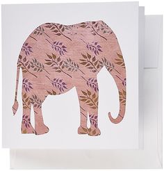 an elephant with leaves on it's back is standing in front of a white card