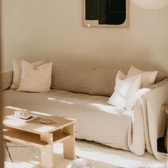 a living room filled with furniture and white walls