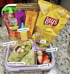 the lunch box is filled with snacks and drinks