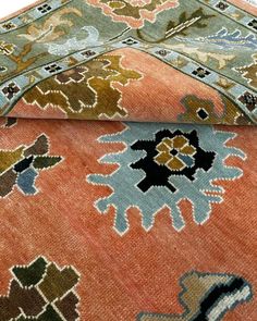 two rugs with different colors and designs on them