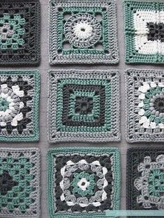 the squares are crocheted together and have flowers on each square, as if they were made from granny smith's afghans