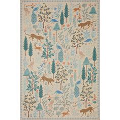 a rug with animals and trees on it