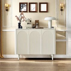 a white radiator in a room with pictures on the wall