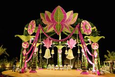 a decorated stage with bells and flowers on it