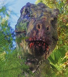 an image of a dinosaur that is in the grass with it's mouth open