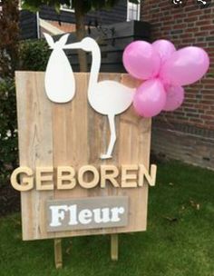 a wooden sign with balloons attached to it that says geboren fleur