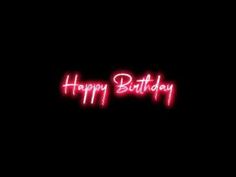 the words happy birthday are lit up in pink neon lights on a black background,