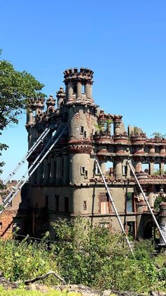 an old abandoned castle sitting on top of a hill