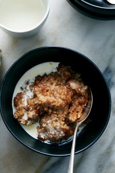 a bowl filled with oatmeal and some milk