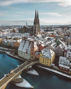 an aerial view of a city with snow on the ground