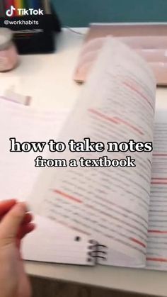 someone is writing on a notebook with the words how to take notes from a textbook