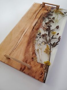 a piece of wood with flowers on it