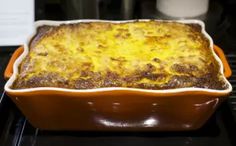 a casserole dish sitting on top of an oven