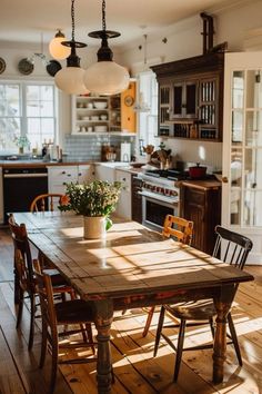 a wooden table sitting in the middle of a kitchen