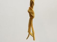 a rope that has been knotted in the shape of a bird's head hanging from a hook