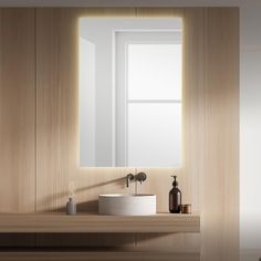 a bathroom with a sink, mirror and window in the wall next to wood paneling