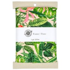 the fabric is printed with tropical leaves and pink flowers on green, white, and beige background