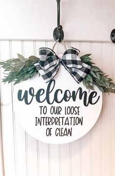 a welcome sign hanging on the front door