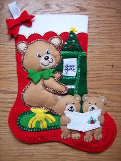 a christmas stocking with two teddy bears on it