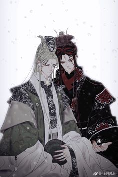 two people dressed in traditional japanese clothing standing next to each other with snow falling on them