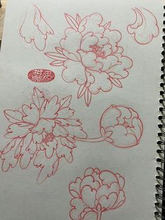 a notebook with drawings of flowers on it