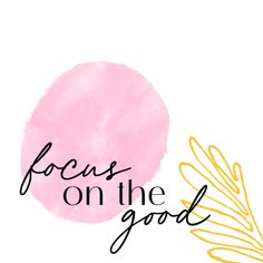 the words focus on the good are painted in black and gold with a pink circle