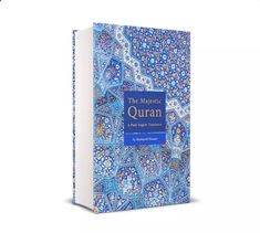 the mysticic quran, with blue and white designs on it's front cover