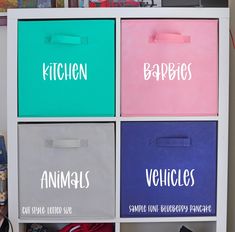 four bins with the words kitchen, babies, and vehicles printed on them