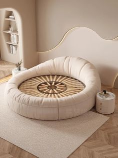 a round dog bed in the middle of a room