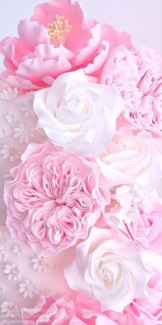 pink and white flowers are arranged together