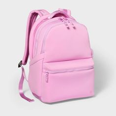 a pink backpack is sitting on the floor