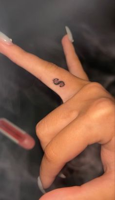 Dollar tattoo,tattoo,finger tattoo