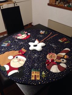 the table is covered with christmas decorations