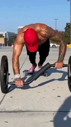 a man is doing push ups on a skateboard