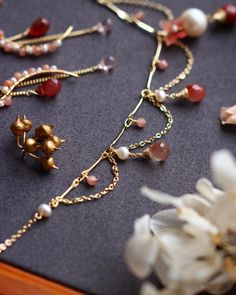 a bunch of jewelry laying on top of a table