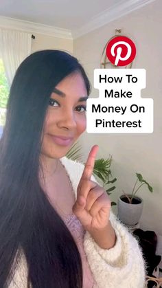 a woman with long black hair holding up a sign that says how to make money on pinterest