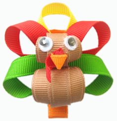 a close up of a toy with a turkey on it's head and eyes