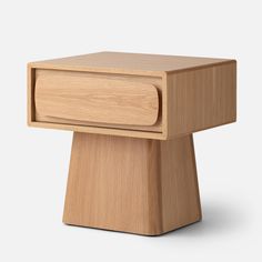 a small wooden table with a drawer on the top and one drawer at the bottom