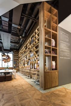 the inside of a store with wooden shelves