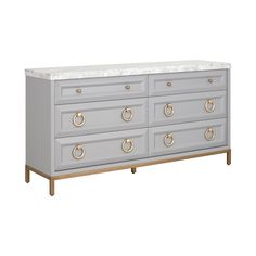 a grey dresser with marble top and brass handles on the bottom, in front of a white background