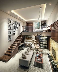 a living room filled with lots of furniture and pictures on the wall next to stairs