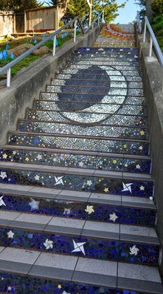 the stairs are decorated with blue and white tiles, stars and crescents on them