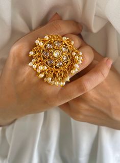 Experience Royal Grandeur with Our Golden Beaded Rajwadi Rings Collection! Transport yourself to the majestic courts of ancient India with our mesmerizing Rajwadi rings, crafted to exude opulence and splendor fit for royalty. Each ring is a testament to the rich heritage of Rajwadi artistry, meticulously handcrafted with precision and adorned with intricate golden beads. Inspired by the regal adornments of Indian nobility, our Rajwadi rings feature a stunning array of traditional motifs and orna Kundan Ring, Jewelry Pakistani, Golden Beads, Rings Collection, Traditional Motifs, Bollywood Jewelry, Pakistani Jewelry, Ancient India