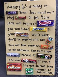a paper sign with candy bars on it