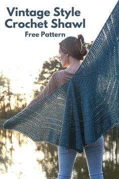 a woman holding up a blue shawl with the text vintage style crochet shawl free pattern