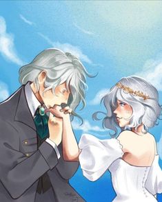 an image of a man and woman in wedding clothes looking at each other's eyes